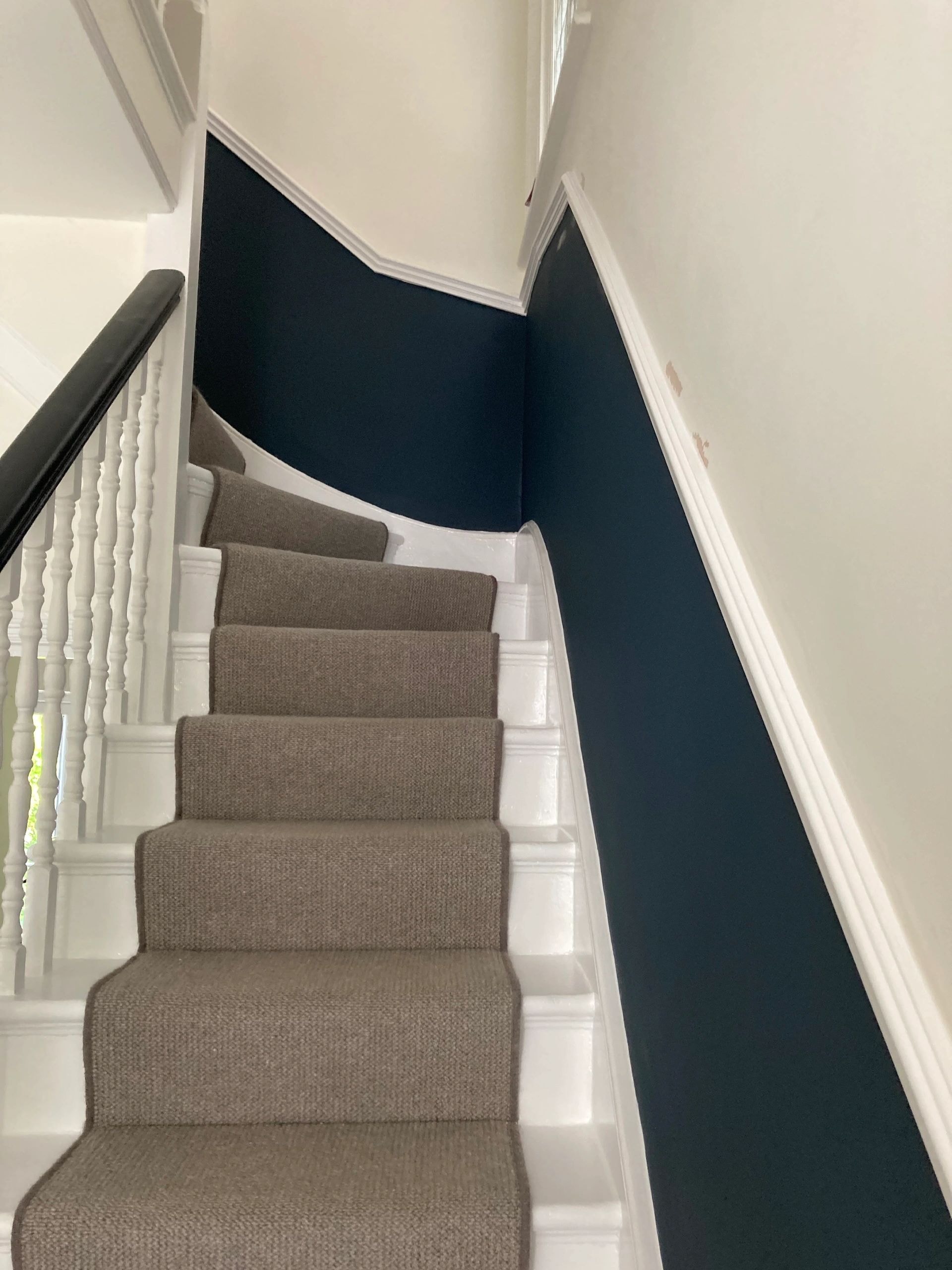 Staircase with navy walls